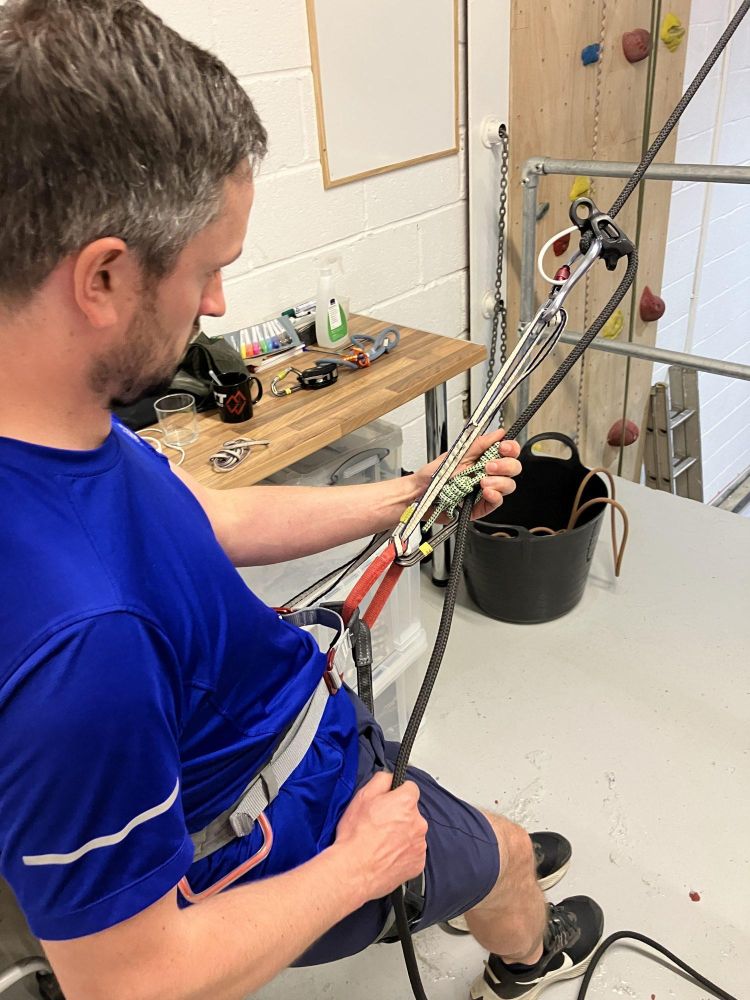 man ready to indoor abseil in brighton