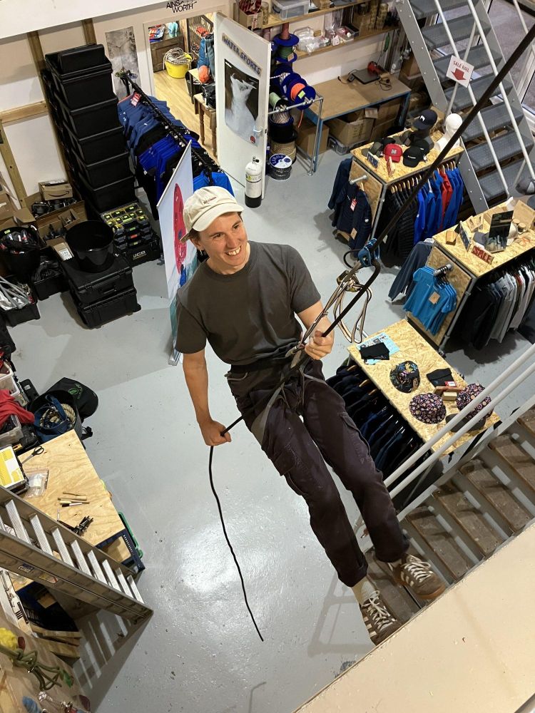 man trying out indoor abseiling in brighton