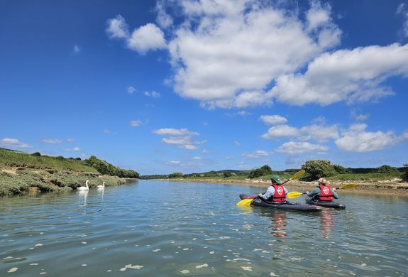 two men on kayak river trip in sussex