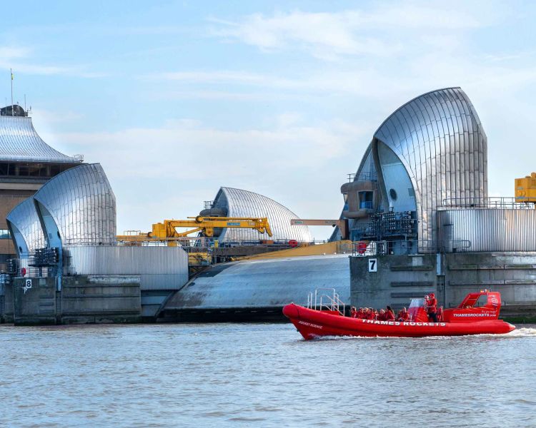 the thames barrier seen on a thames barrier explorer's 80 minute thames rockets speedboat experience
