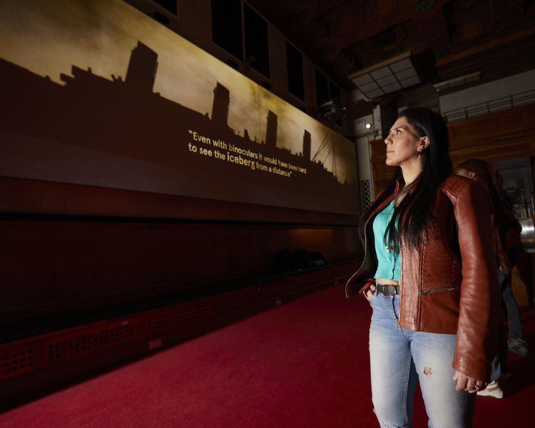 woman looking at the titanic inquiry exhibit at sea city museum in southampton