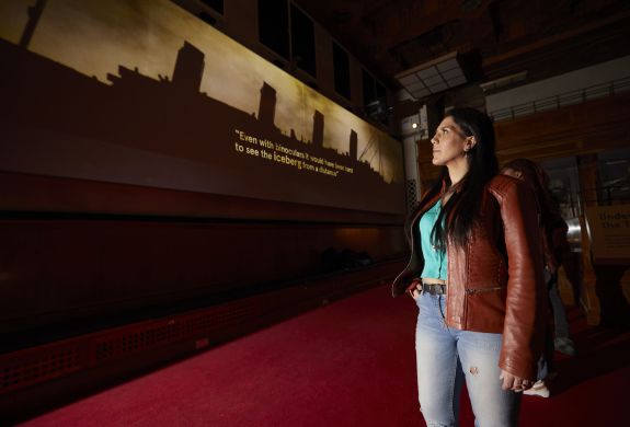 woman looking at the titanic inquiry exhibit at sea city museum in southampton
