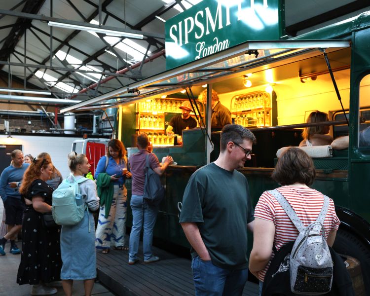 people at a gin bar on a sipsmith london gin distillery tour and tasting