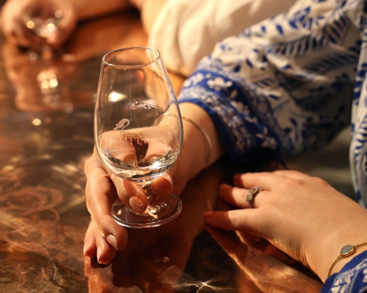 lady hold glass for gin tasting a sipsmith london gin distillery tour and tasting
