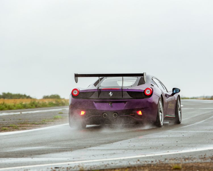 ferrari 458 on the track as part of a ferrari 458 challenge vs lamborghini or mclaren driving experience