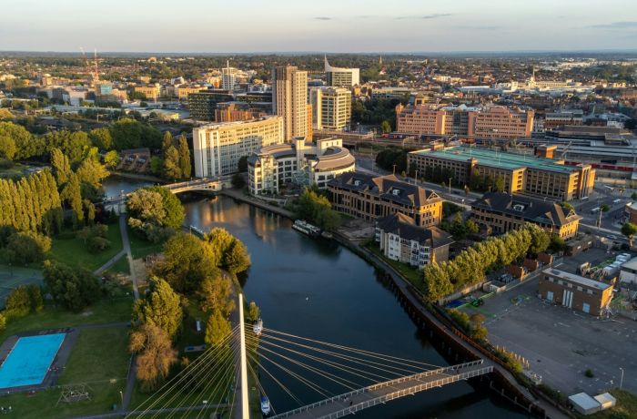 birds eye view of a city with a river winding through it