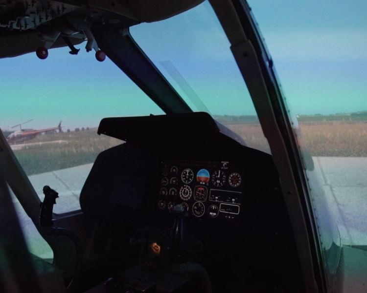 the inside of a helicopter flight simulator with the digital view at deeside flight simulators