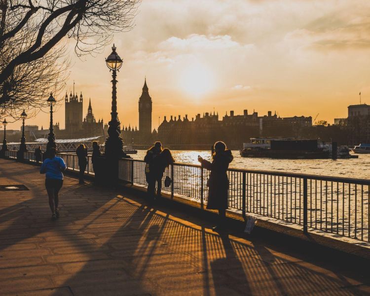 Couple walking by the tower of london in winter