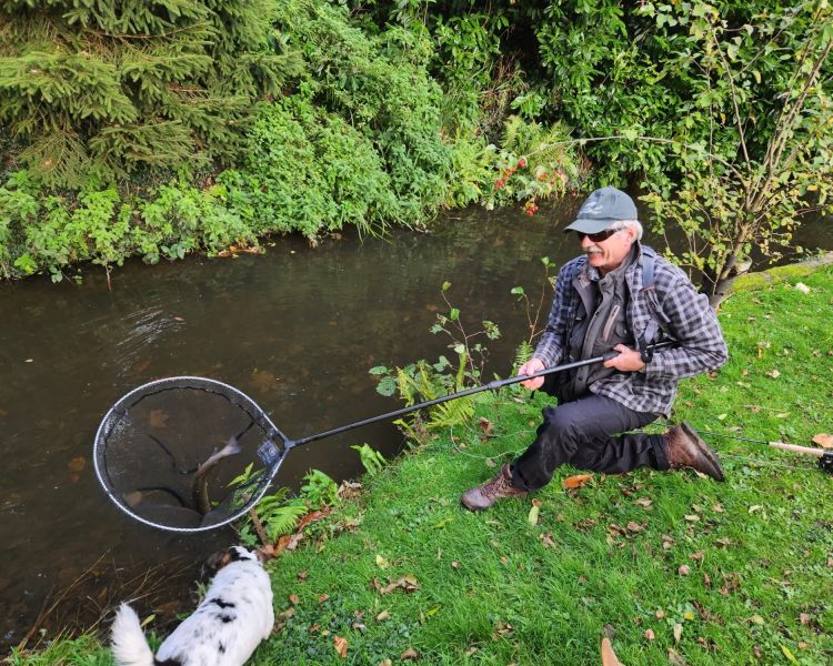 Man fishing with caught fish