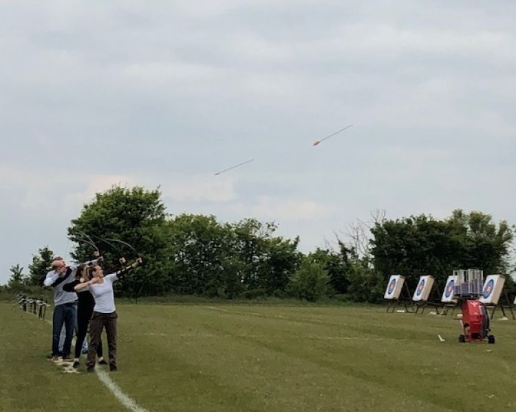 Arrows flying through air on archery session