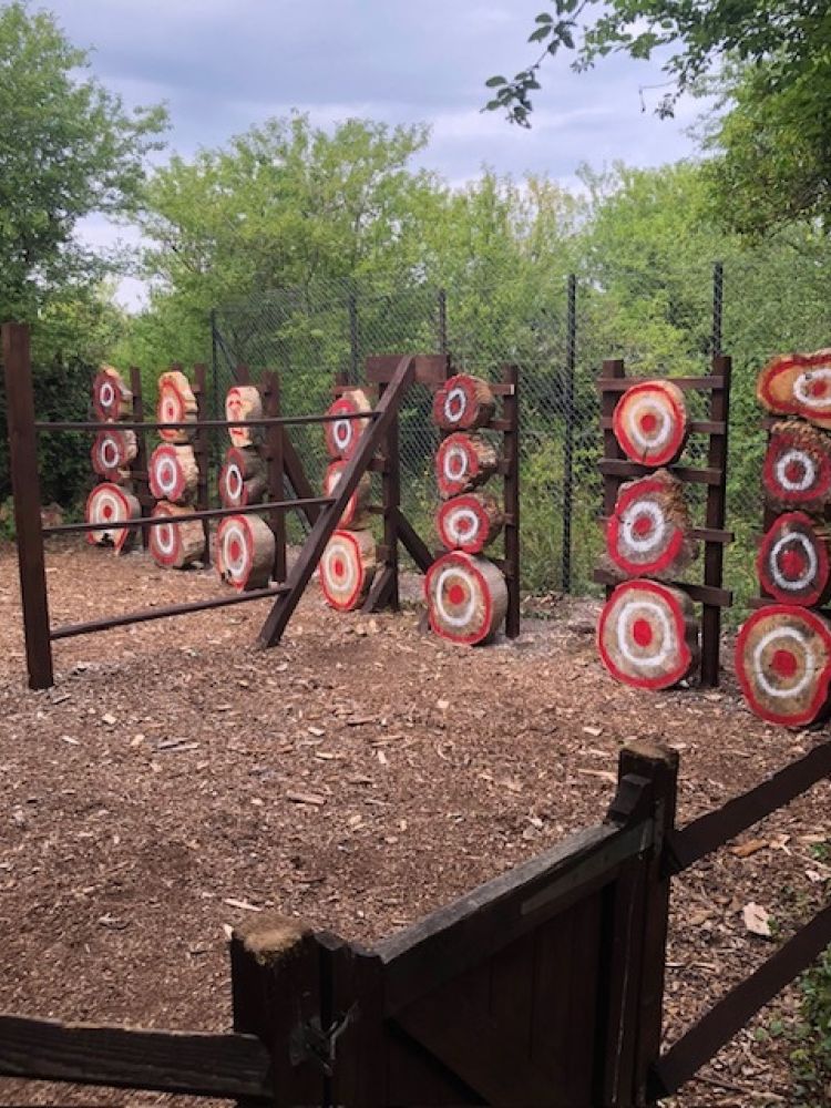 a row of axe throwing targets used on an axe throwing experience day