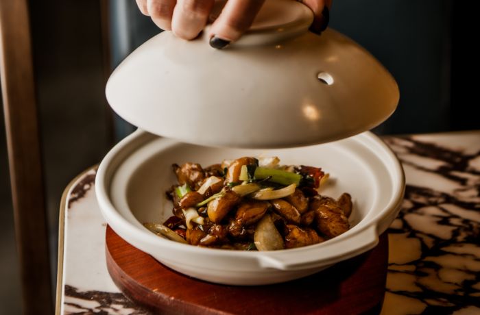 dish being presented on table at gouqi in london