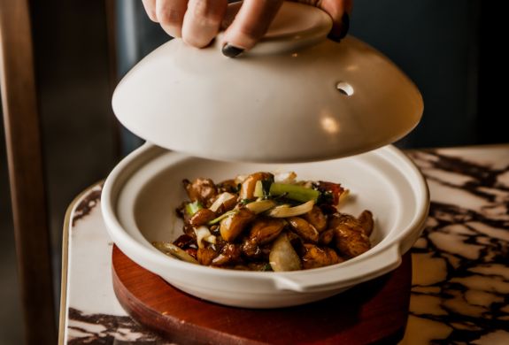 dish being presented on table at gouqi in london