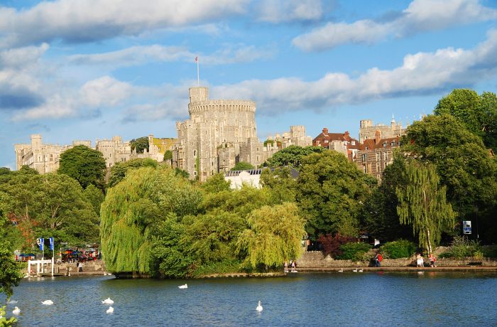 view of windsor castle seen from across the river on a sunny day