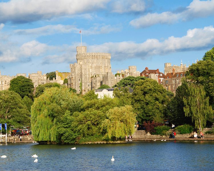 view of windsor castle seen from across the river on a sunny day