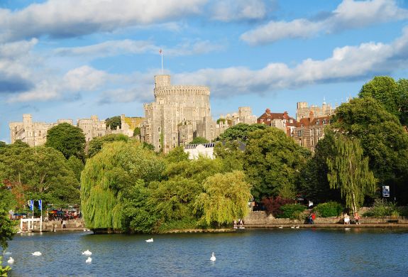 view of windsor castle seen from across the river on a sunny day