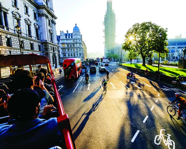 sightseeing tour bus going past westminster