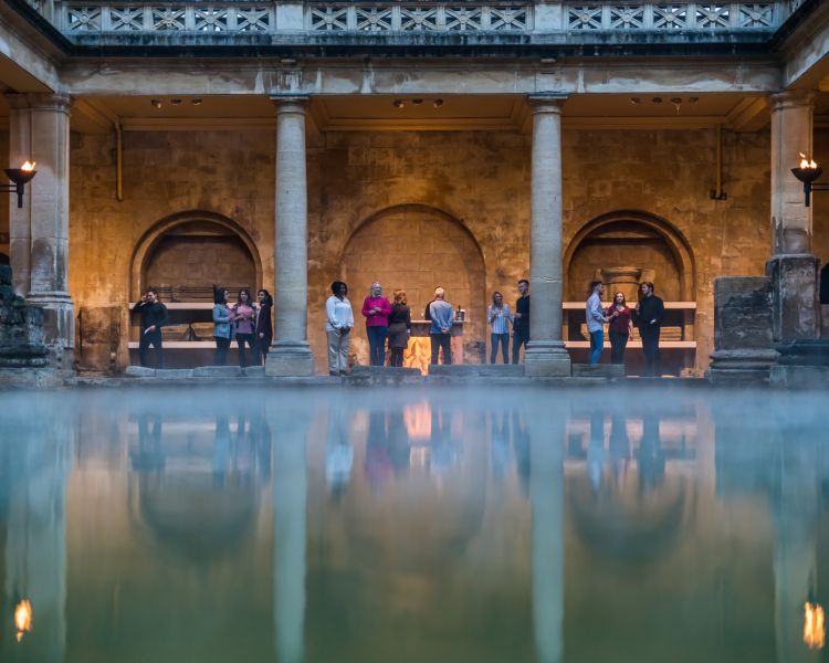 people visiting the roman baths in bath