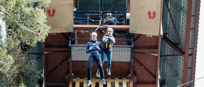 two people doing the plummet free fall experience at zip world