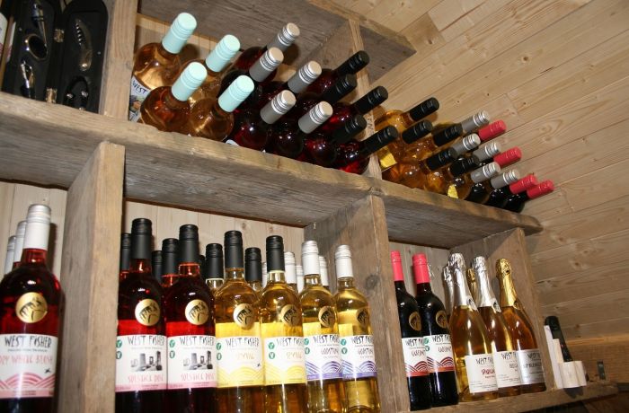 bottles of wine on shelf for a wine tasting experience in kent