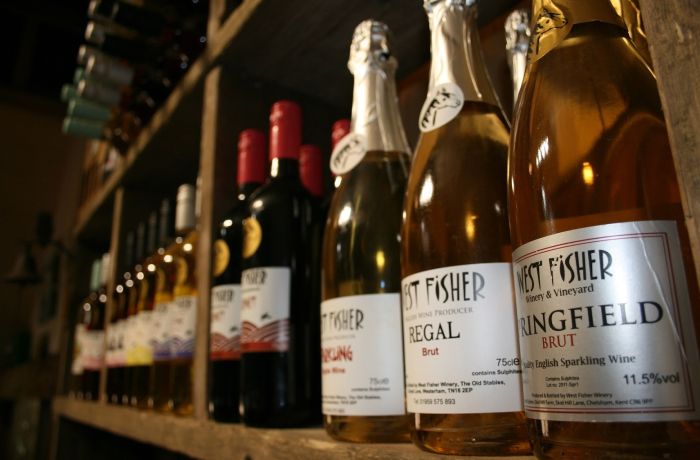 bottles of wine on shelf for a wine tasting experience in kent