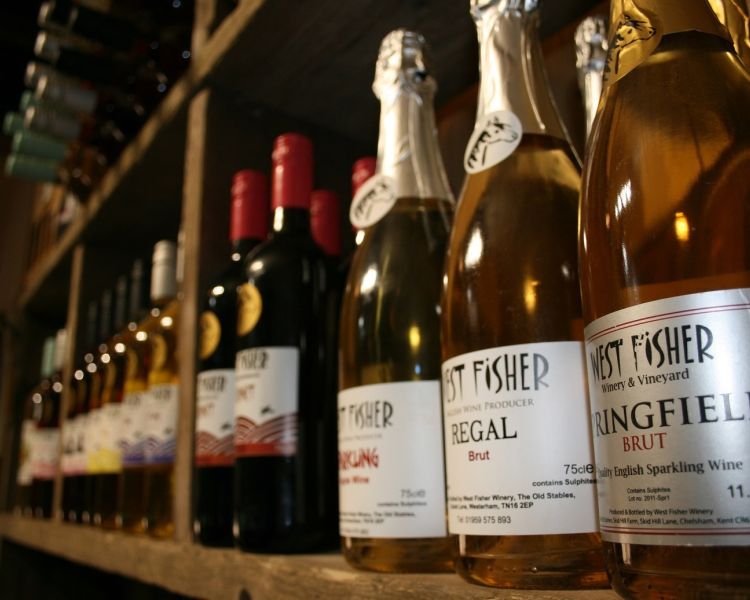 bottles of wine on shelf for a wine tasting experience in kent