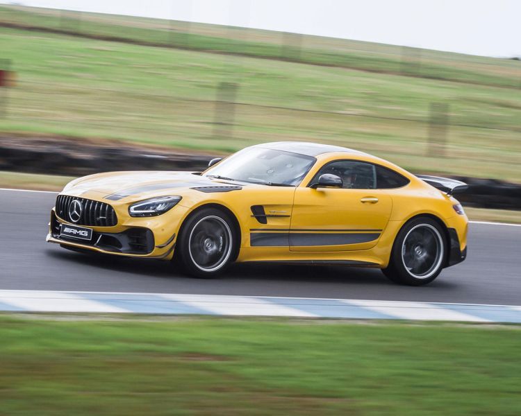 a yellow mercedes on a race track during a driving experience day