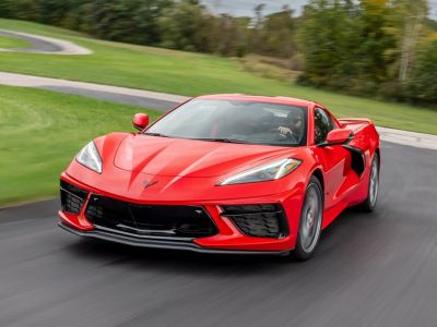 a red corvette on a race track during a driving experience day