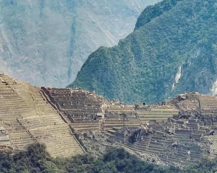 closeup of a citadel in the mountains seen on a remote drone flying experience