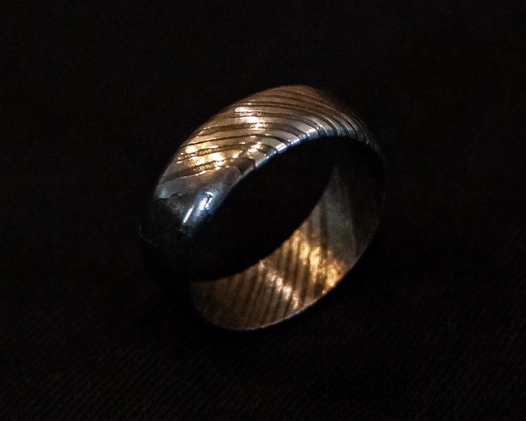 a patterned metal ring made on a damascus ring making experience day