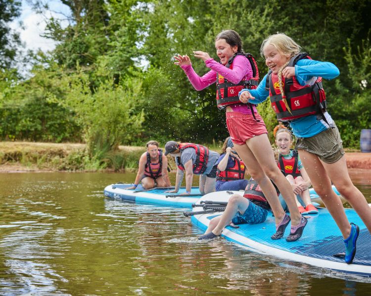 stand up paddleboarding on an all inclusive kids day camp at pgl