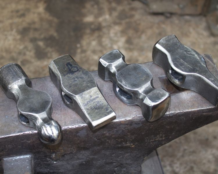 examples of hammer heads made on a hammer making blacksmith experience