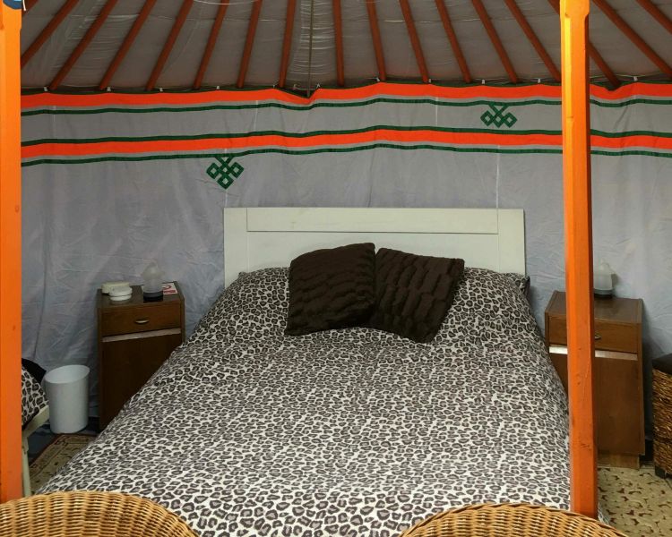 one of the double beds inside one of the devon yurts