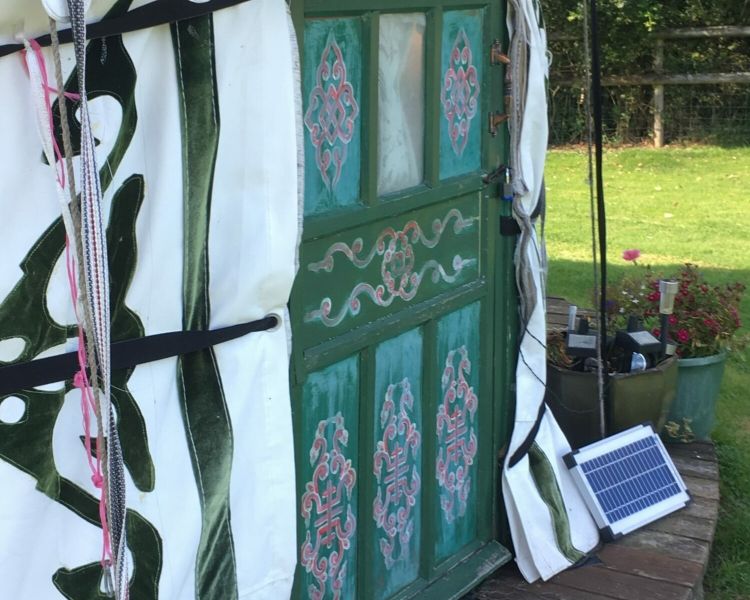 the outside entrance of one of the devon yurts