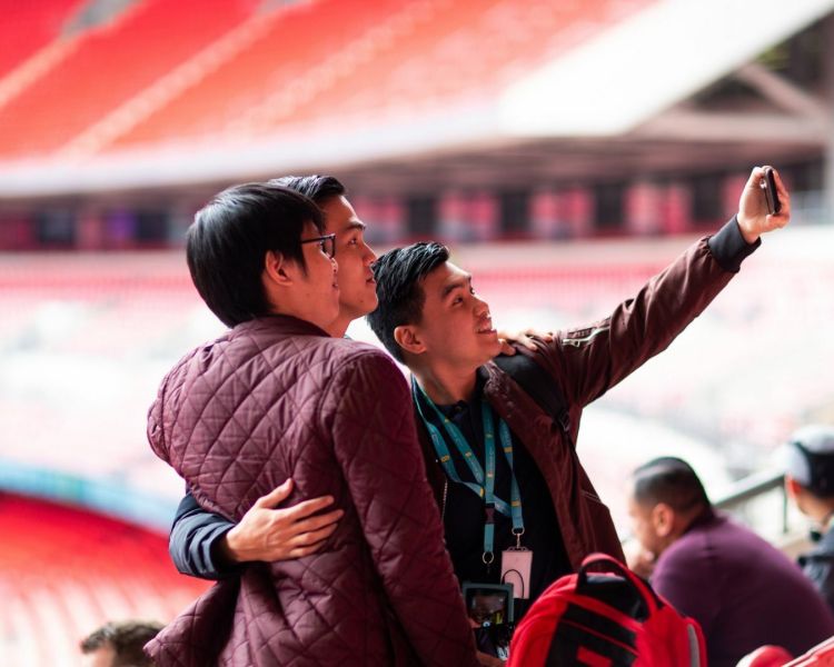 people taking selfie at wembley stadium