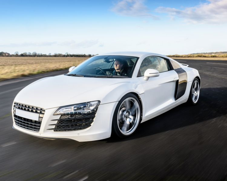 a white supercar on a race track at car chase heroes driving experience day