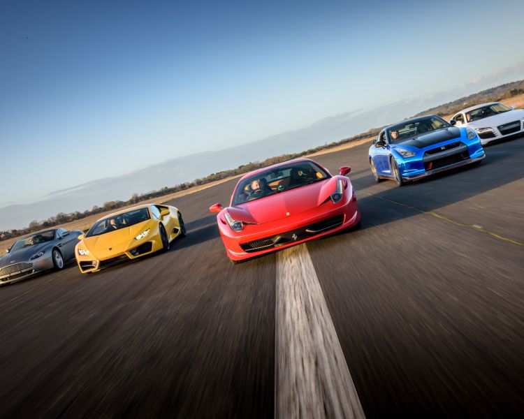 five supercars on a race track at car chase heroes driving experience day