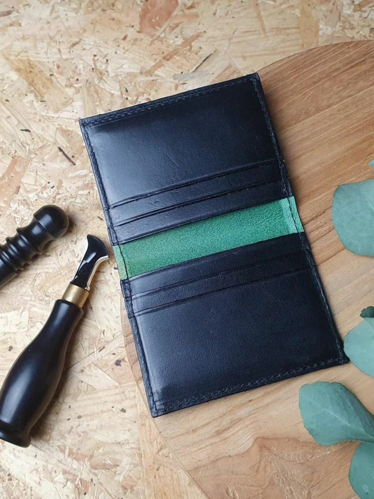 Black wallet with green lining