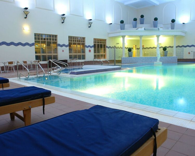Swimming pool with statue belton woods spa day