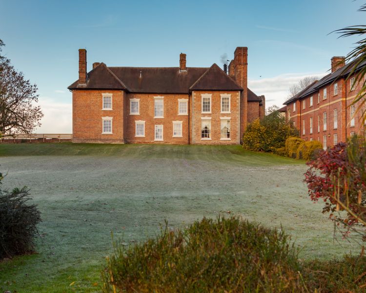 outside shot of luxury hotel spa with large lawn