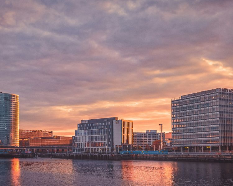 Drone shot of belfast city centre at sunrise