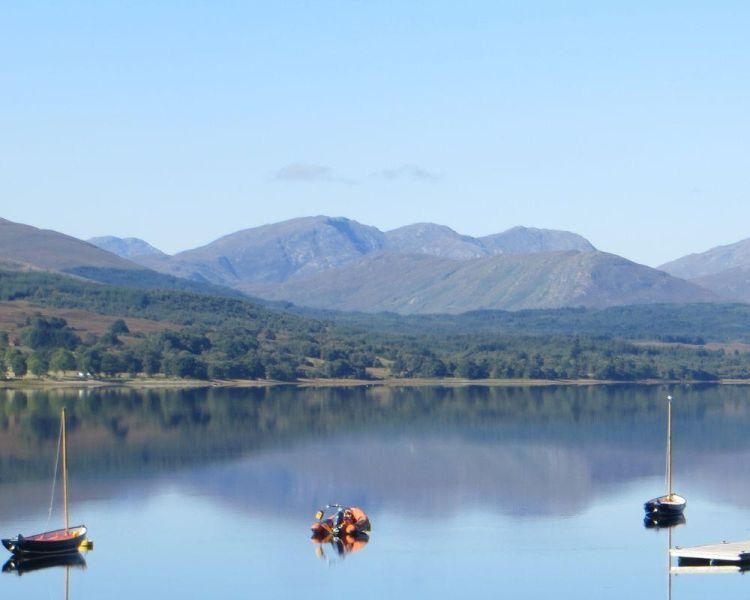 Boats on a loch in the scotish highlands