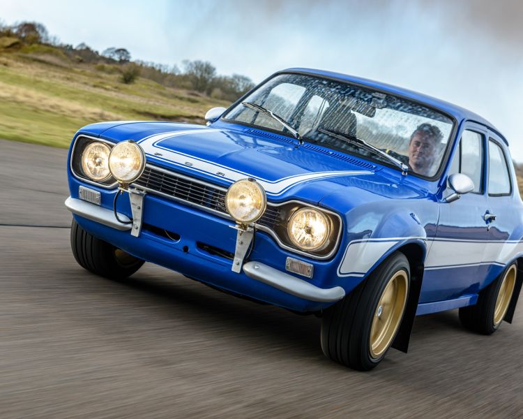 a blue escort on a race track as part of a driving experience day