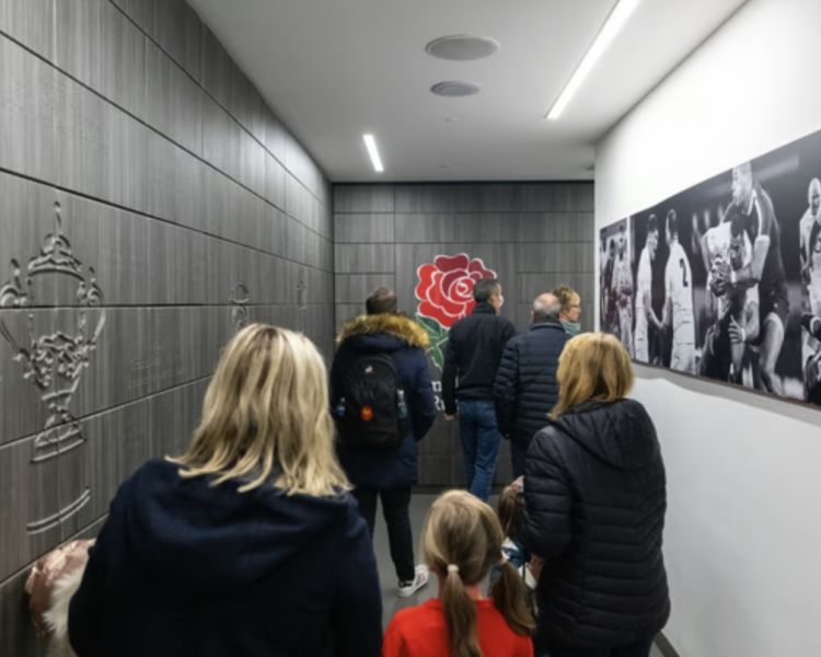 visitors walking the players tunnel on a twickenham stadium tour on a london break for two