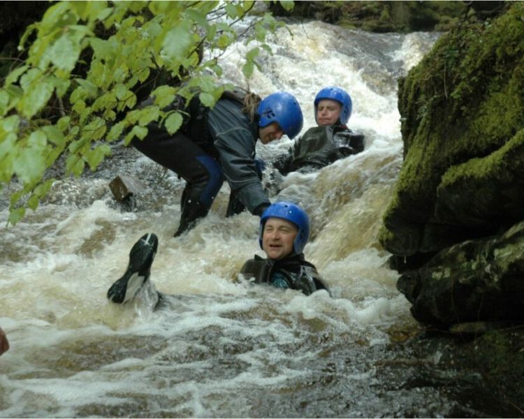 people enjoying a canyoning descent experience day