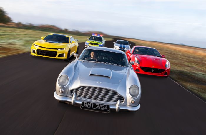 five cars on a race track for an all star track day driving experience