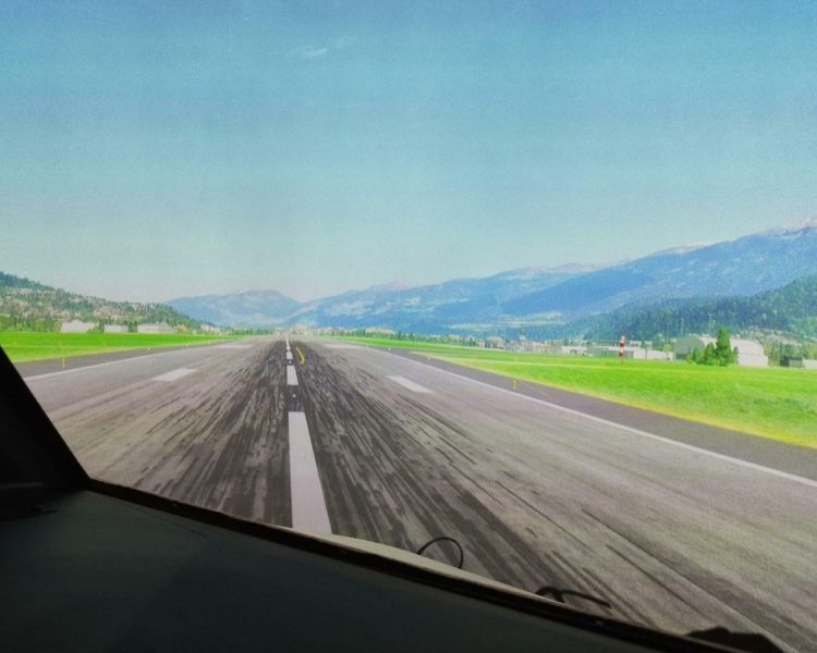 an airport runway seen on a Boeing 737 - 800NG flight simulator experience