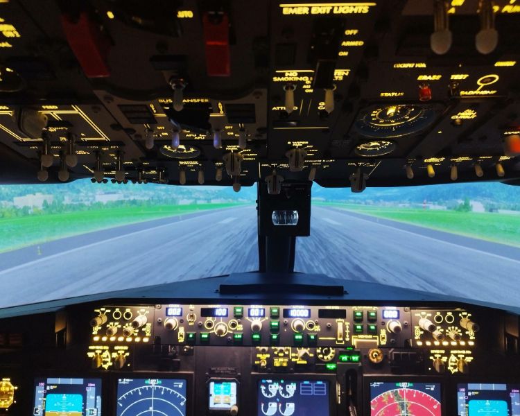 a Boeing 737 - 800NG coming in to land on a runway as part of a flight simulator experience