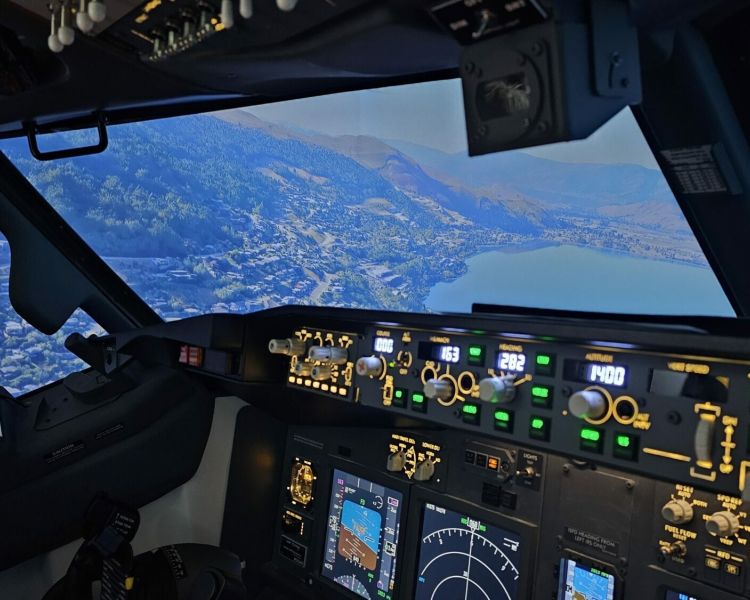 view of mountains from the cockpit of a Boeing 737 - 800NG on a simulator experience