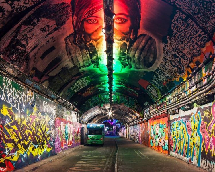 looking down into the banksy tunnel in london which is covered in graffiti